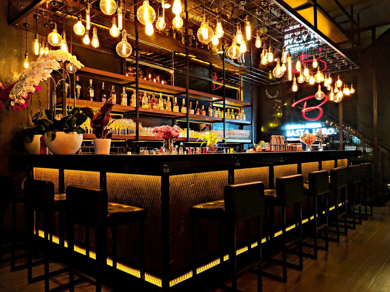 Upscale bar interior with warm Edison bulb lighting