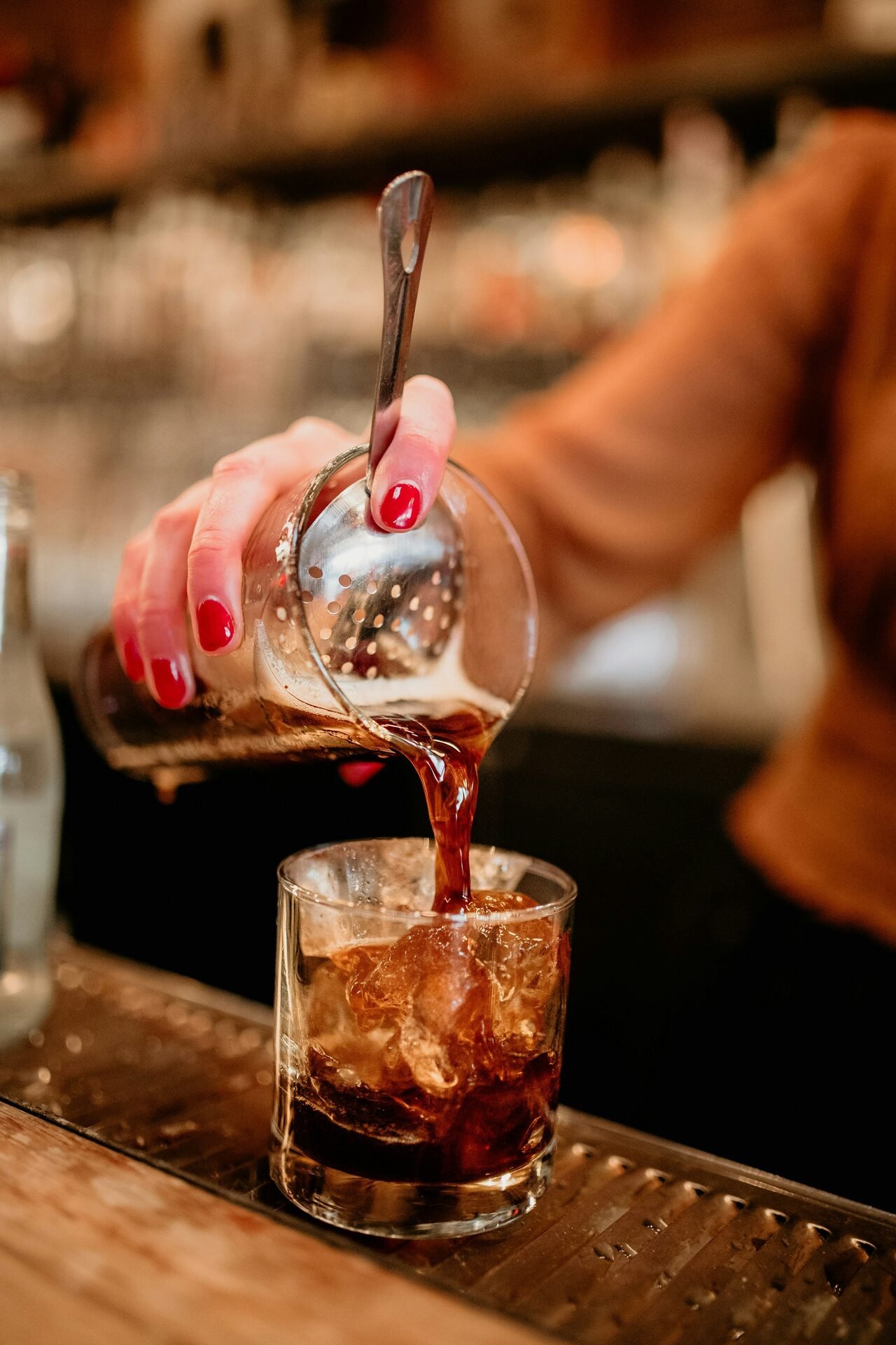 Saxophone player performing under moody red light